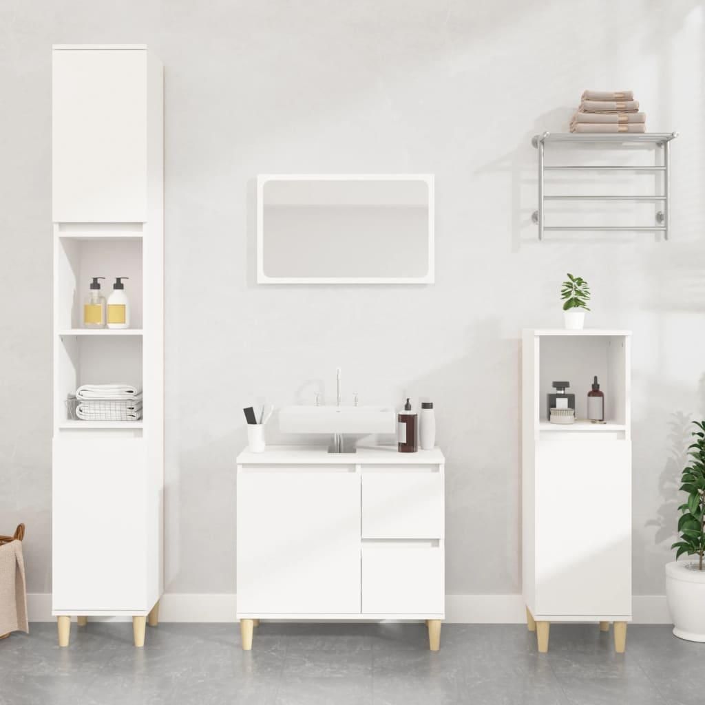 A clean, modern bathroom setup featuring white furniture and accessories against a light gray wall.