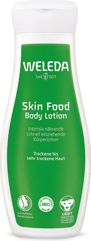 A product shot of a Weleda Skin Food Body Lotion bottle against a white background.
