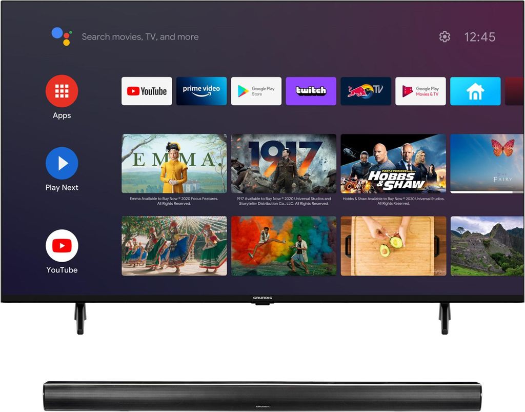 A television screen displaying a smart TV interface with various apps and content previews, placed above a soundbar.