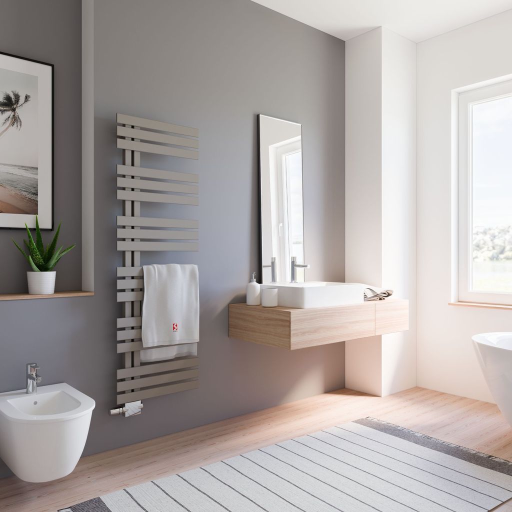 A modern bathroom with a bidet, sink, towel warmer, and a large window.