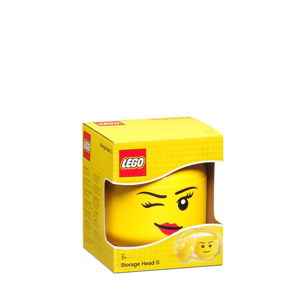 A yellow LEGO storage head in its packaging.