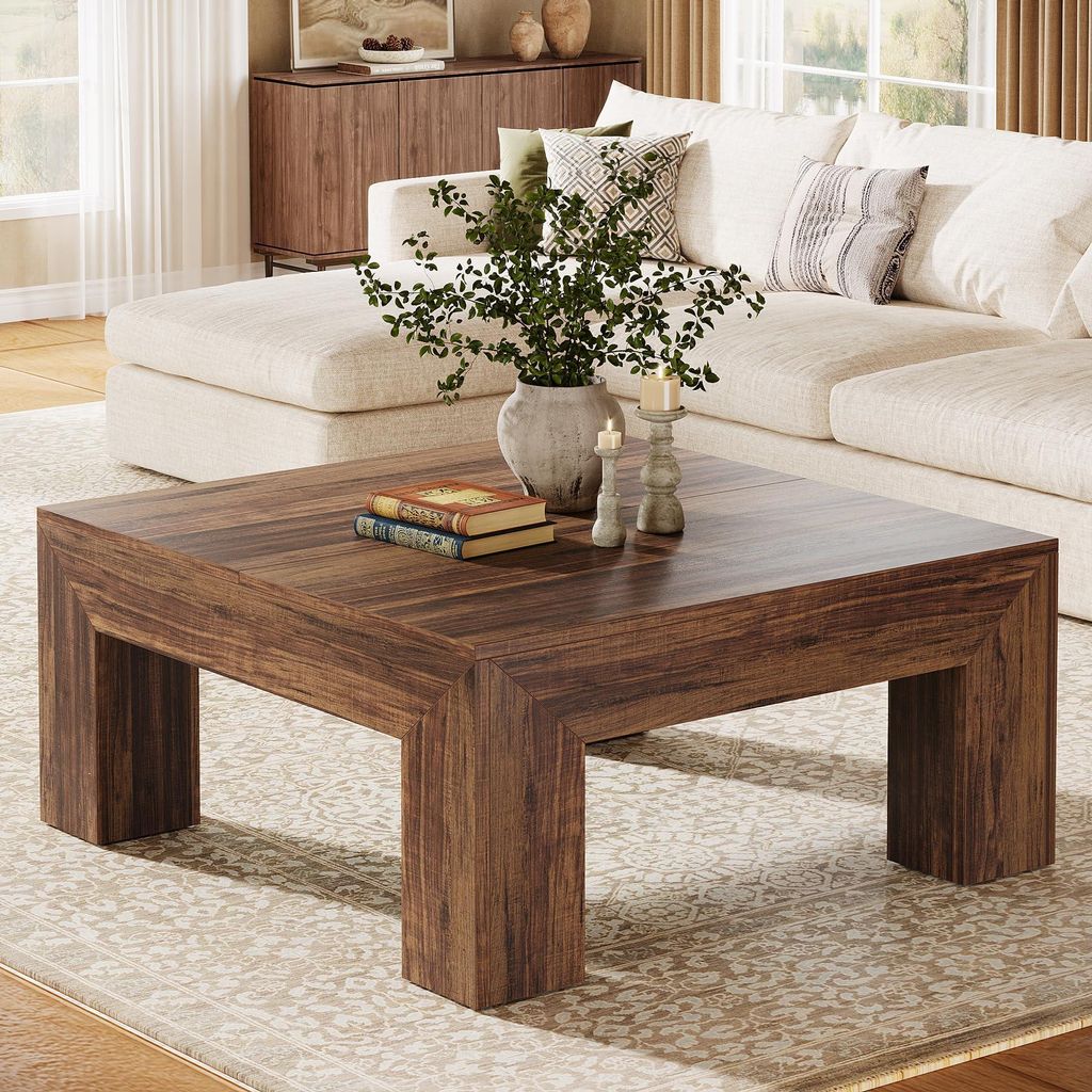 A living room scene with a coffee table and sofa.
