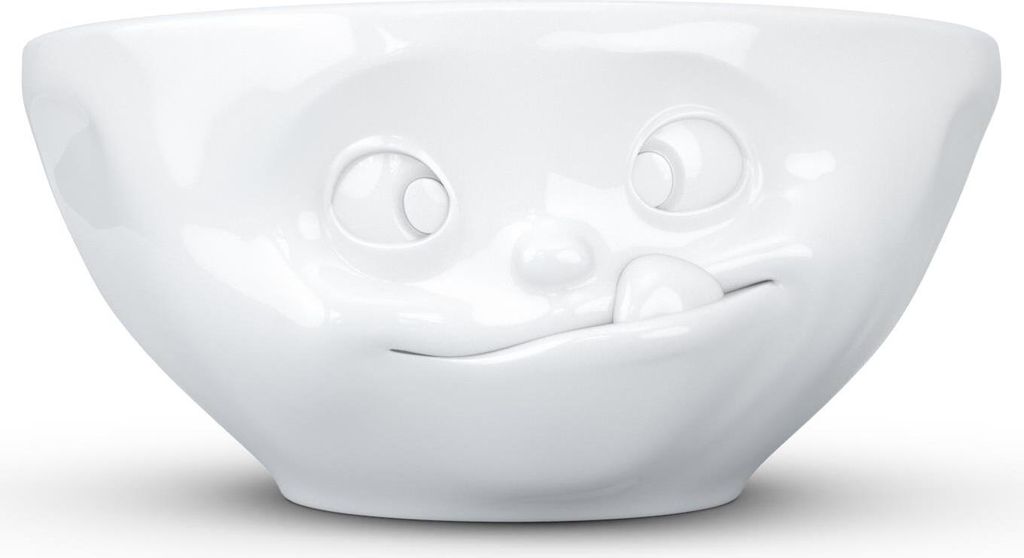 A white ceramic bowl with a face design.