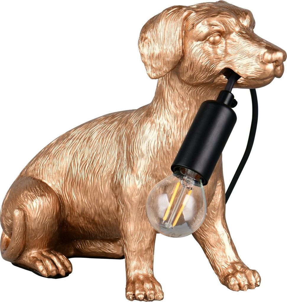 A golden dog-shaped lamp with a light bulb in its mouth, set against a white background.
