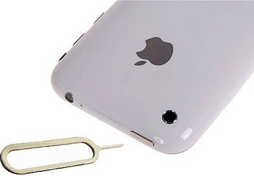 A close-up shot of the back of a white iPhone with a SIM card ejector tool in the foreground.