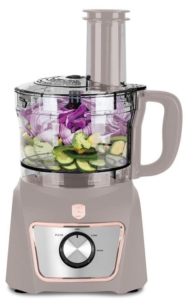 A food processor filled with chopped vegetables, shown from the front.