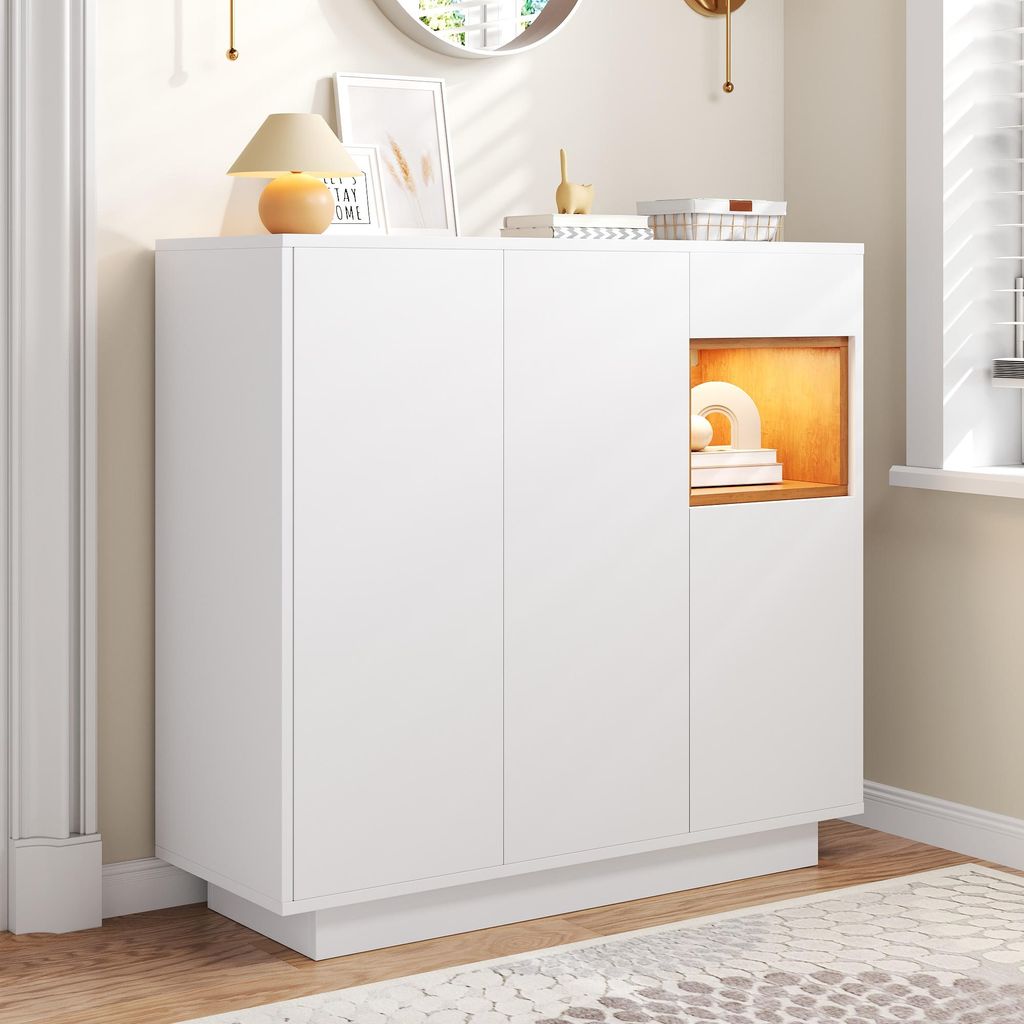 A white shoe cabinet with a wood-accented open shelf, placed in a hallway or entryway.