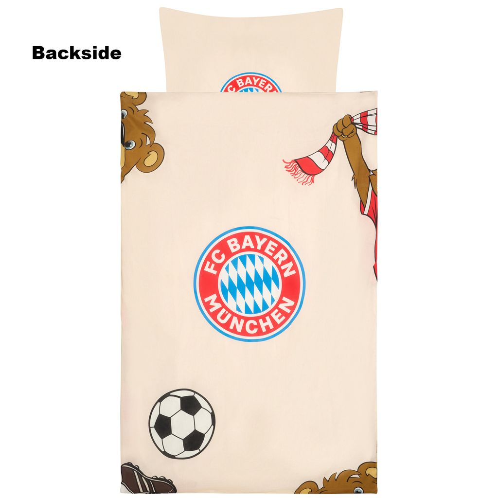 A close-up view of a duvet cover with a cartoon bear mascot and the FC Bayern München logo.