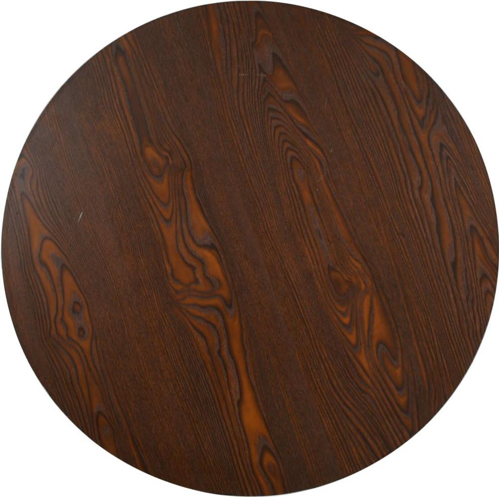 A top-down view of a round wooden table.