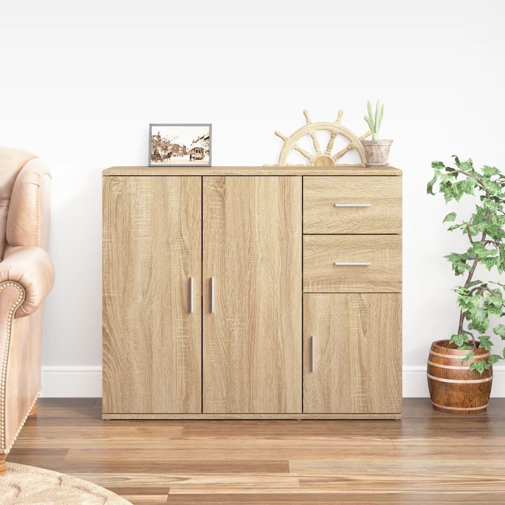 A wooden sideboard with drawers and doors, placed in a room with a sofa and a plant.