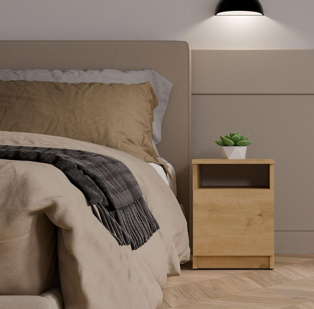 A bedroom scene with a bed and a nightstand.
