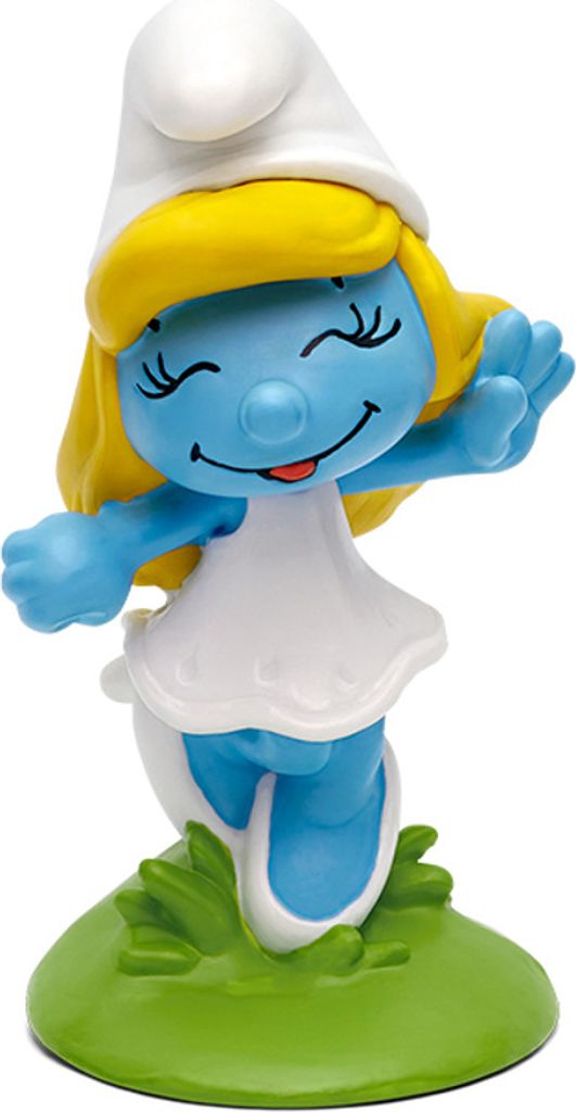 A figurine of Smurfette standing on a green base.