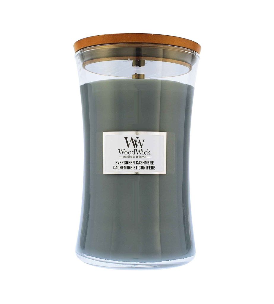 A WoodWick Evergreen Cashmere candle in a glass jar with a wooden lid, presented on a white background.