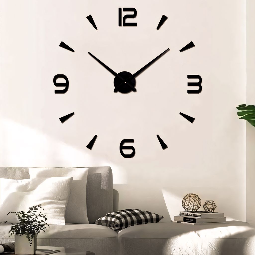 A large wall clock is mounted on a white wall above a sofa in a living room.