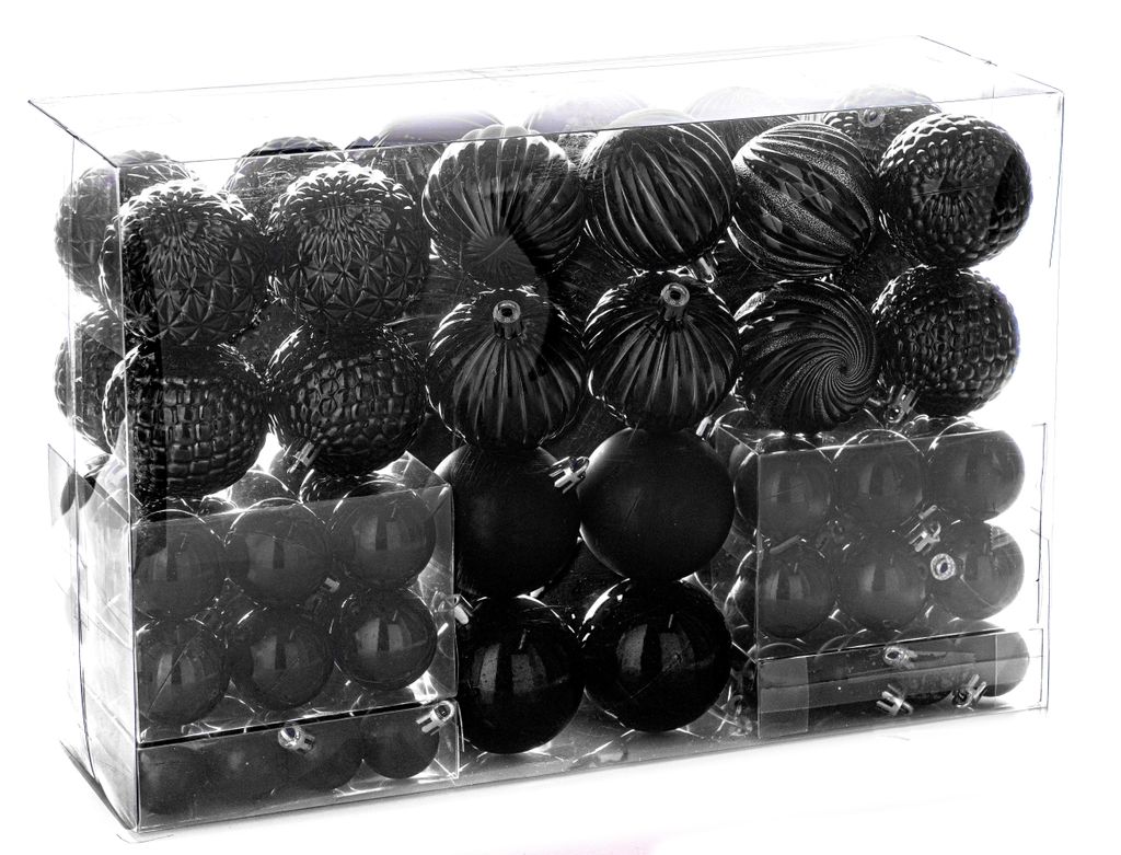 A clear, professional studio shot of a box of black Christmas ornaments.