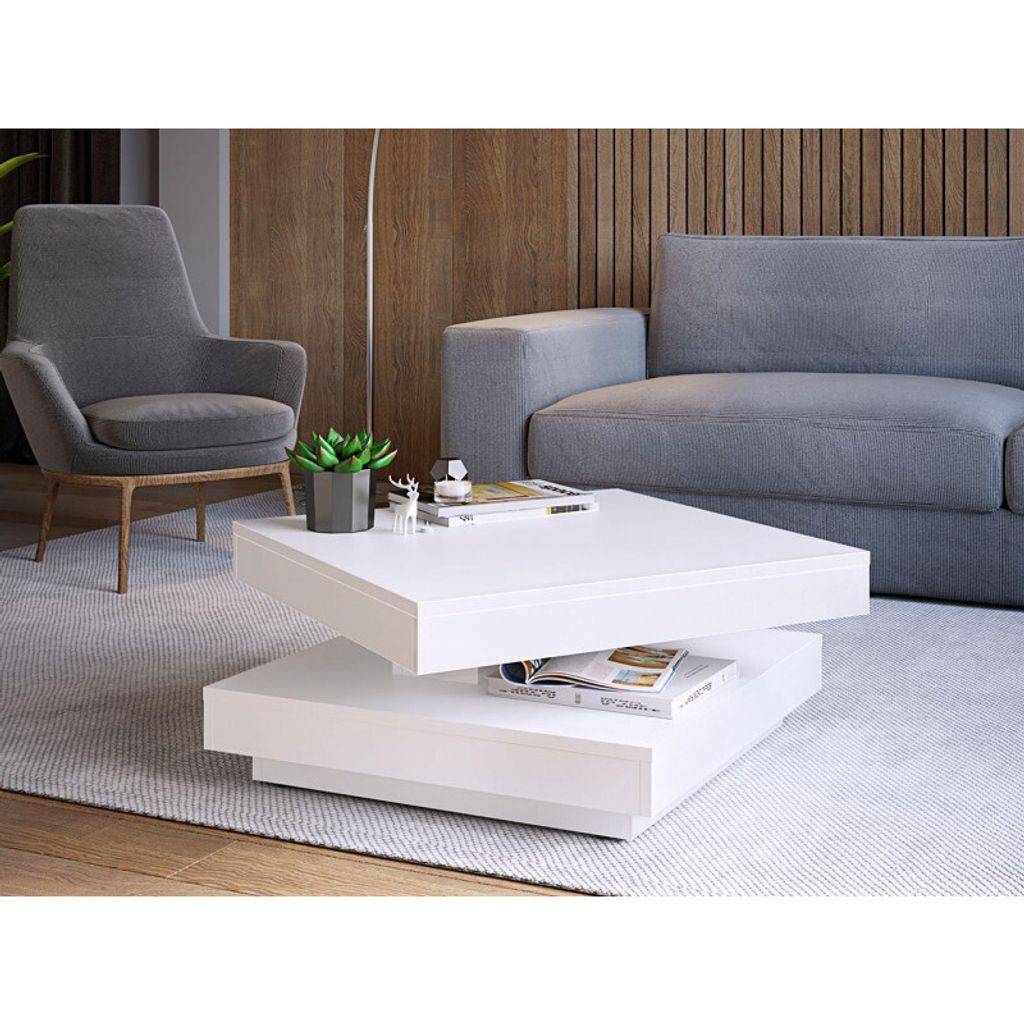 A modern living room scene with a white coffee table, a gray sofa, and a gray armchair.