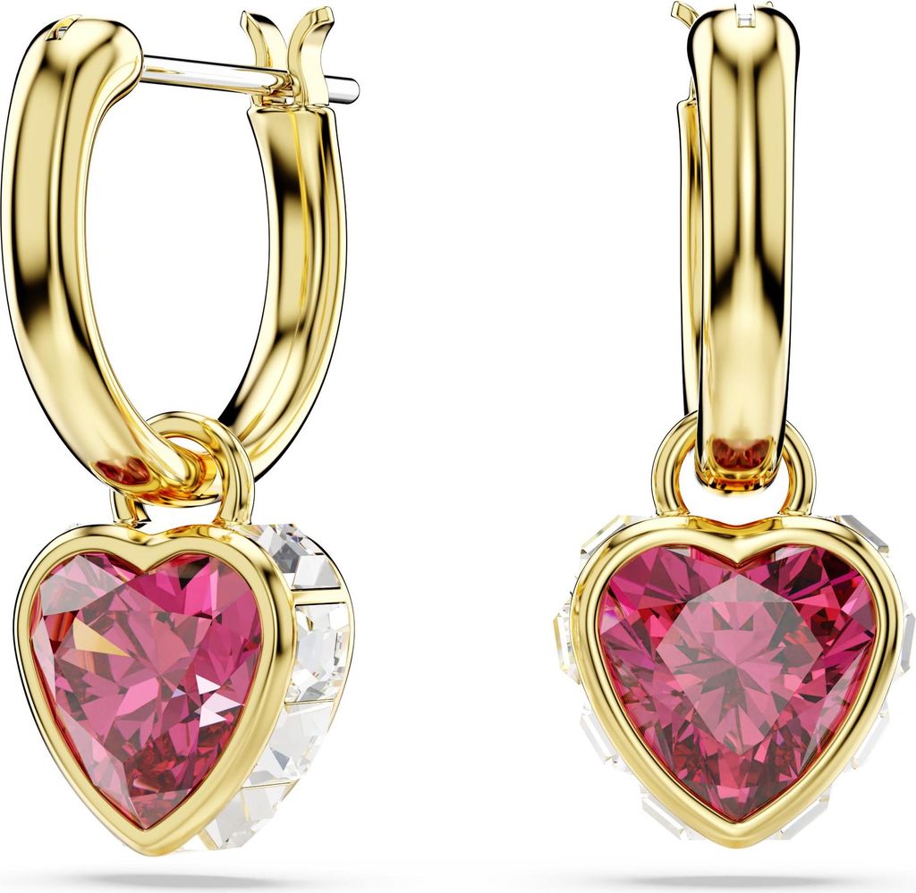A pair of gold hoop earrings with heart-shaped pink and clear gemstones.