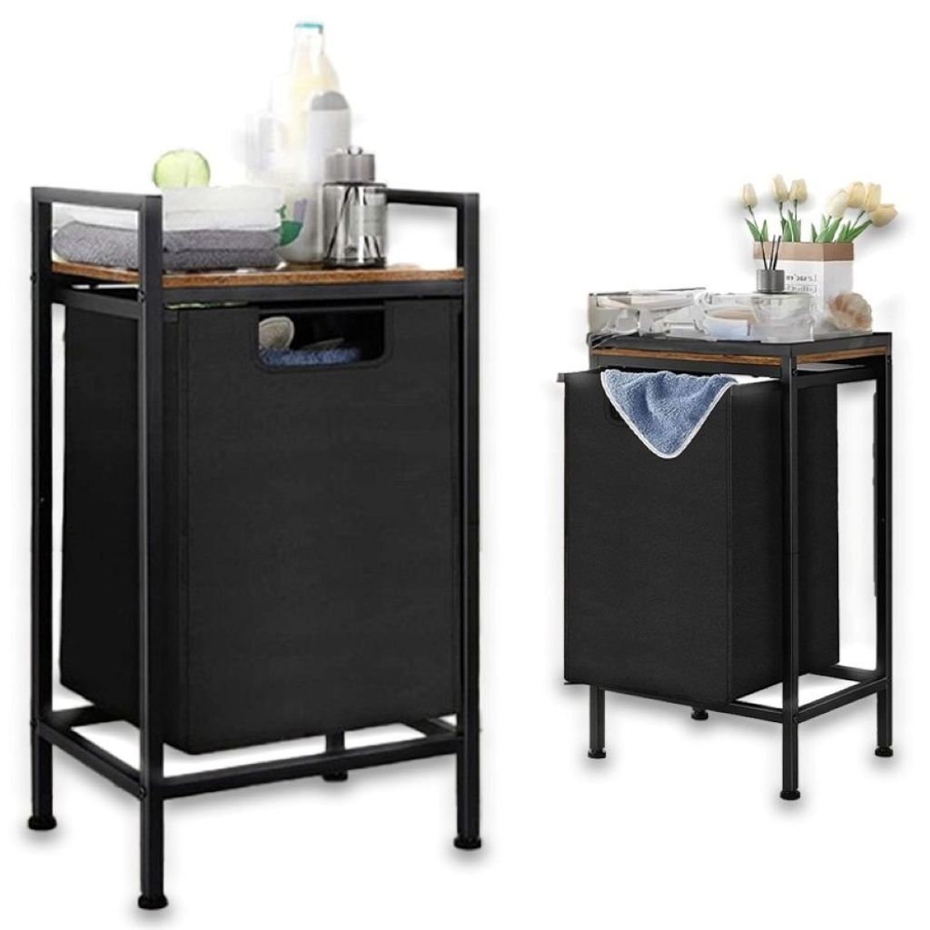 Two laundry baskets with shelves are shown against a white background. The basket on the left is larger and more prominent, displaying towels and bottles on its shelf. The basket on the right is smaller and further back, with a towel draped over its openin