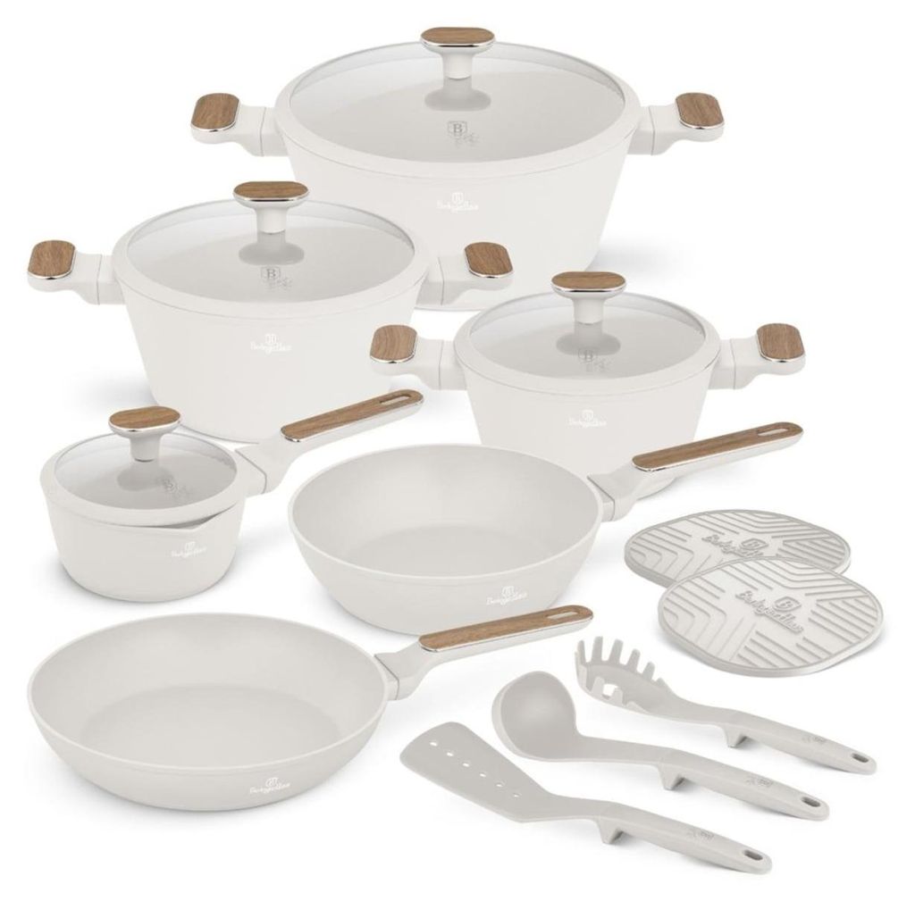 A collection of white cookware and kitchen utensils arranged on a white background.