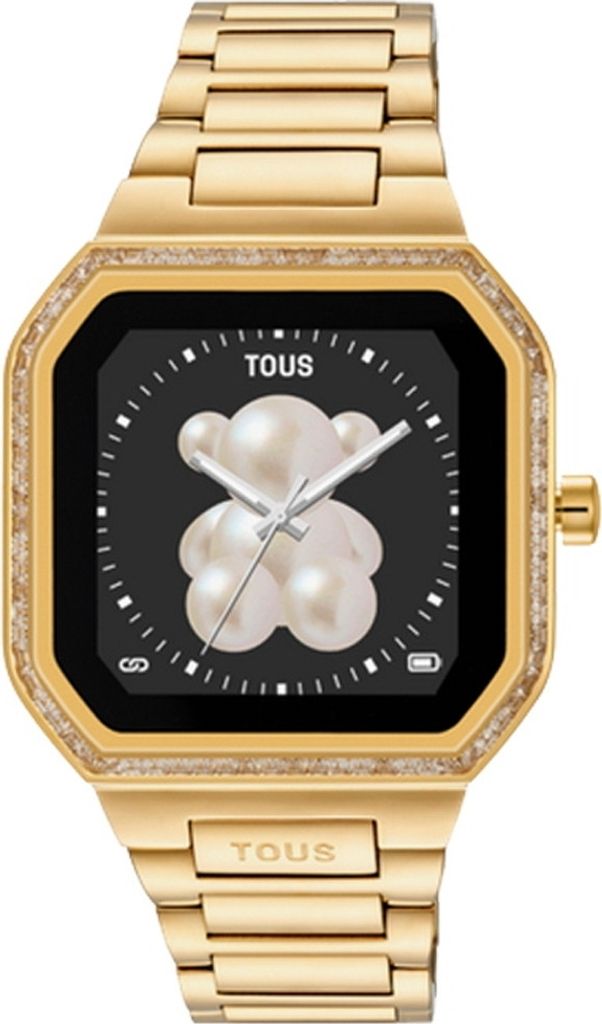 A close-up studio shot of a gold smartwatch with a black screen displaying a pearlescent teddy bear face.