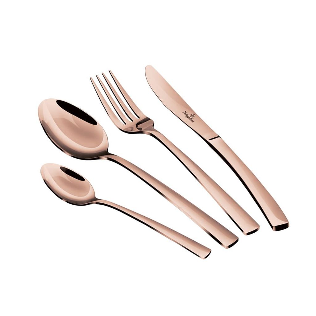 A set of rose gold cutlery, including a knife, fork, and two spoons, arranged diagonally on a white background.