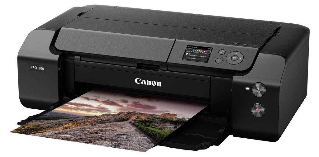 A black Canon imagePROGRAF PRO-300 printer is shown printing a landscape photograph.