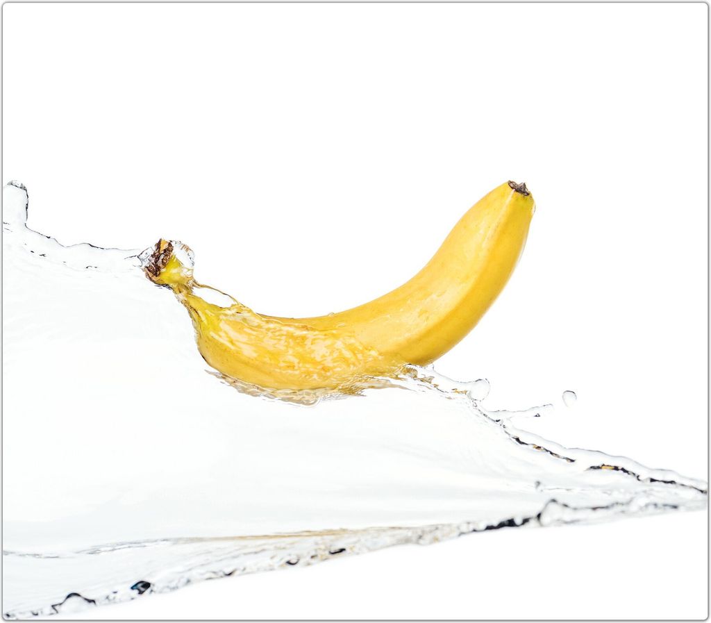 Spritzschutz Herdabdeckplatte Schneidebrett aus Glas Banane auf Wassersplash 1-Teilig (60x52cm)