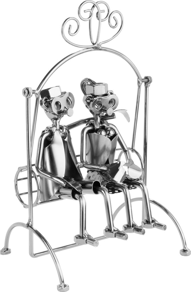 A metal sculpture of a couple sitting on a swing.