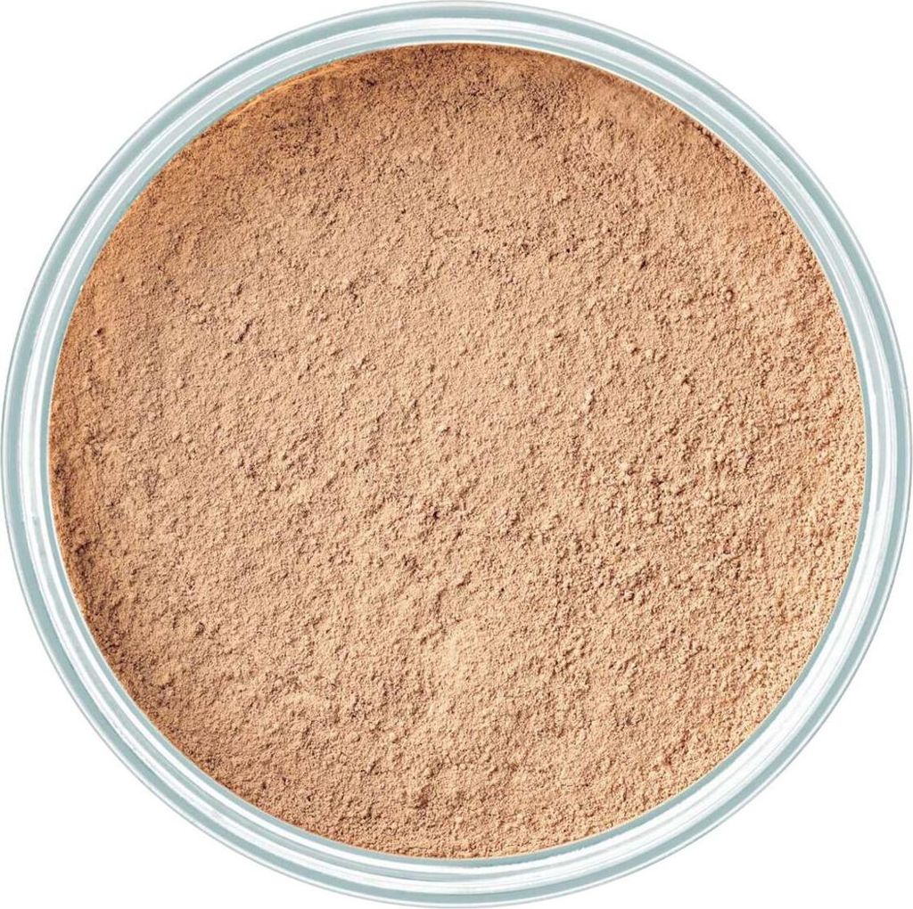 A top-down view of loose mineral powder foundation in a container.