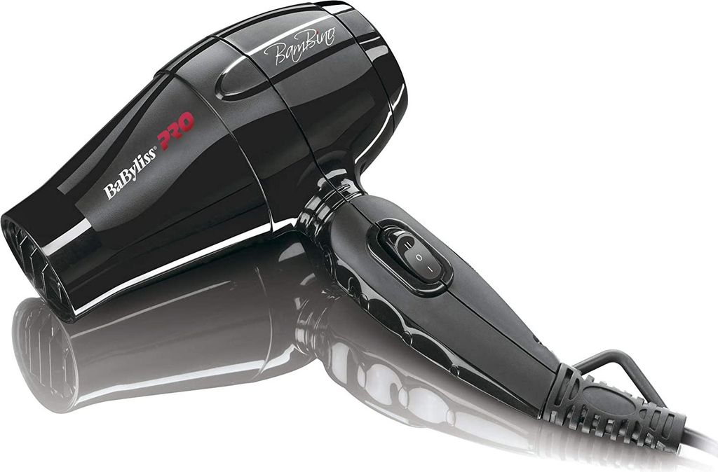 A black Babyliss hair dryer is shown on a reflective white surface.