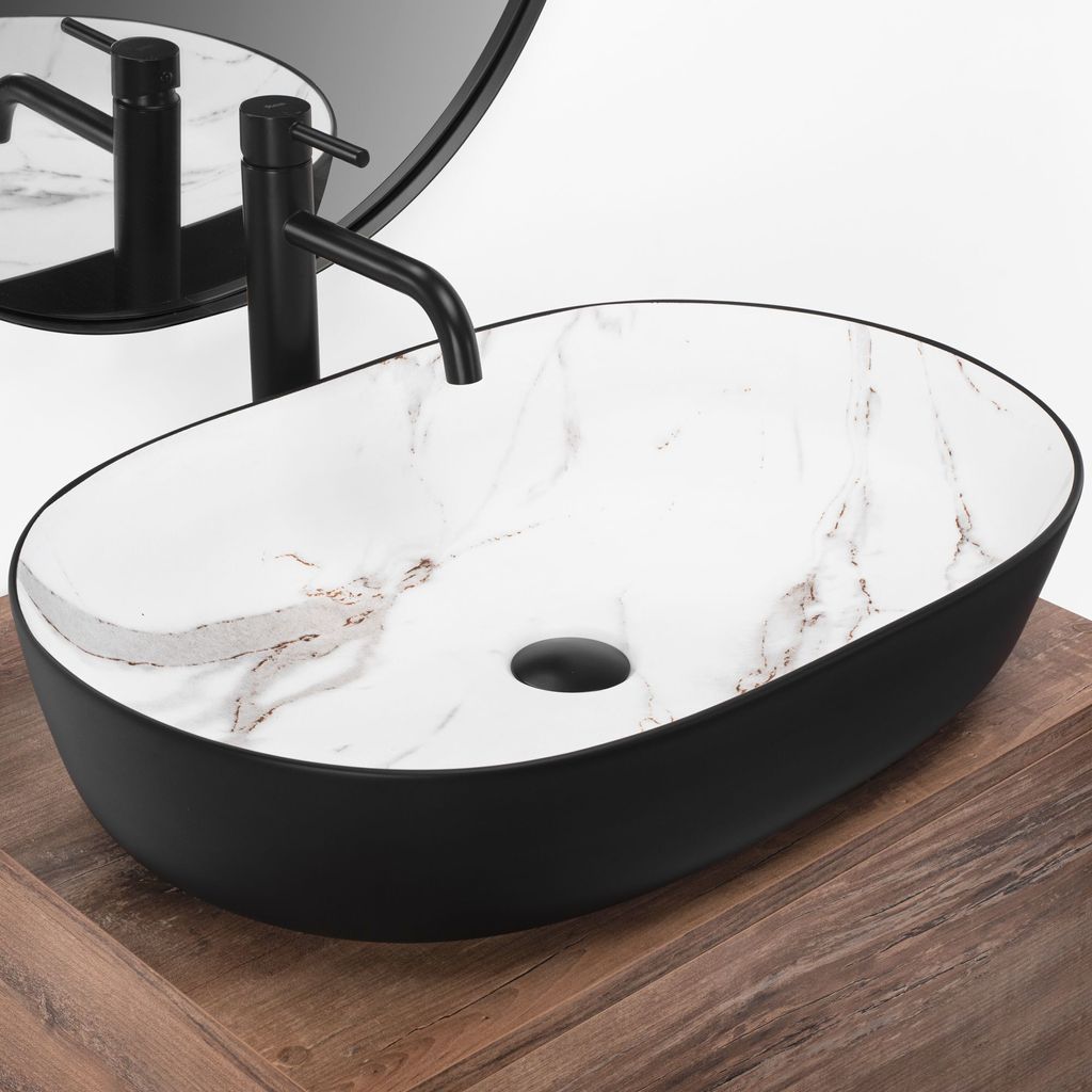 A black oval vessel sink with a marble-patterned interior sits on a wooden countertop.