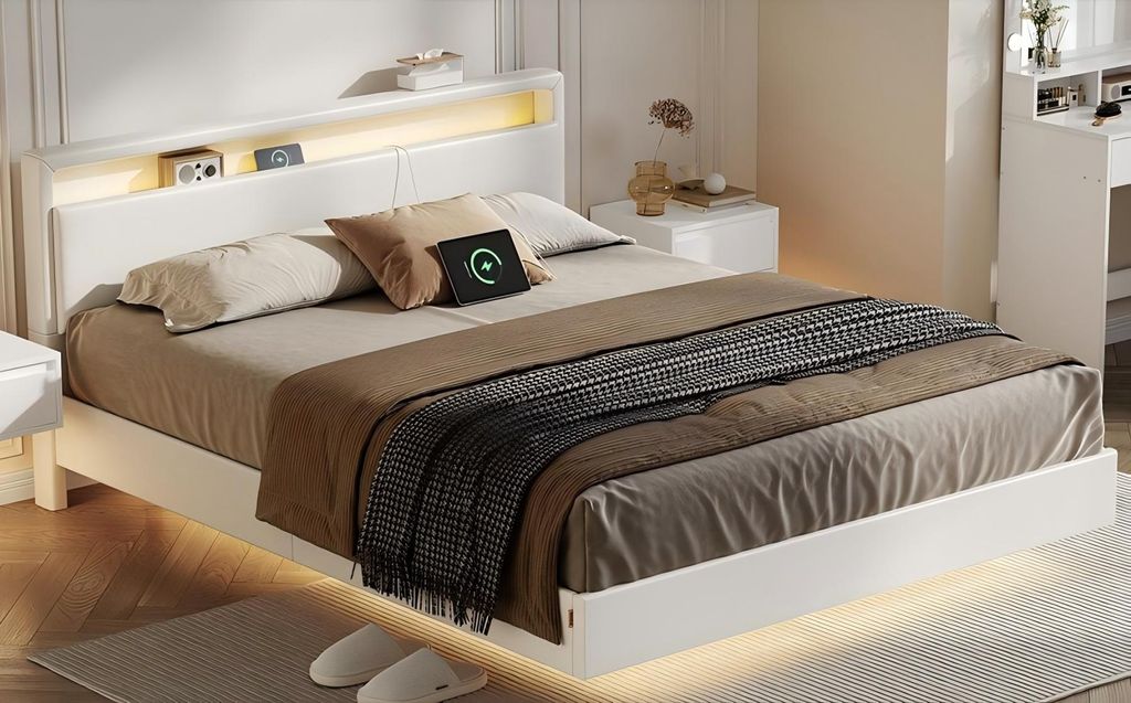 A modern bedroom with a white bed, nightstand, and desk.