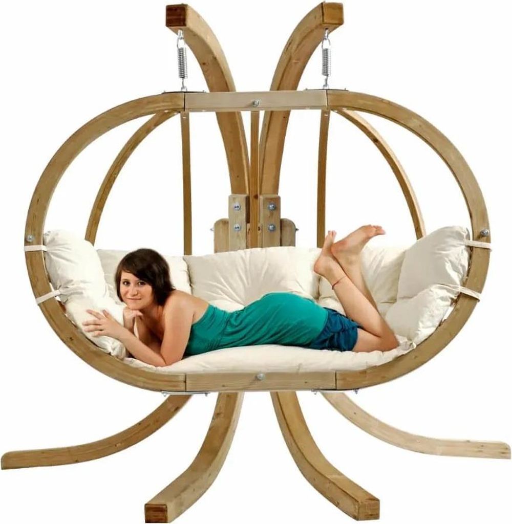 A woman is lying on a hanging chair.