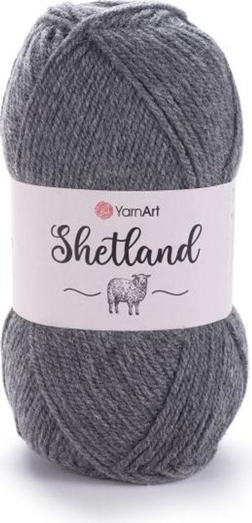 A ball of grey yarn with a label wrapped around it.