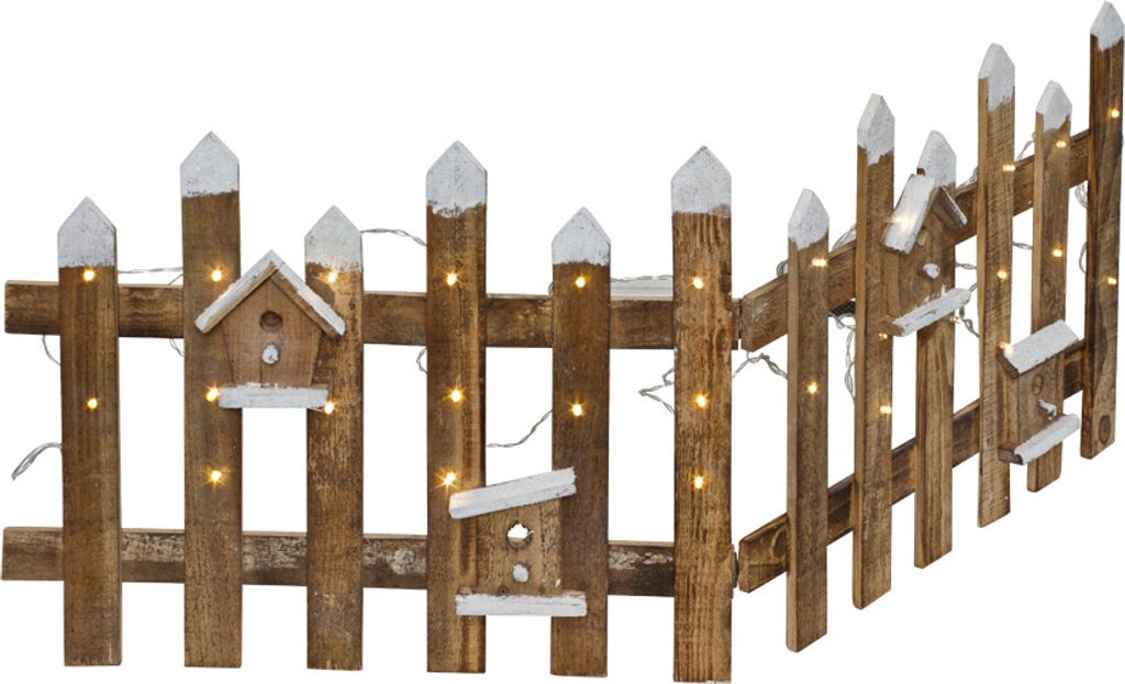 A wooden fence decorated with small birdhouses and illuminated by LED lights.