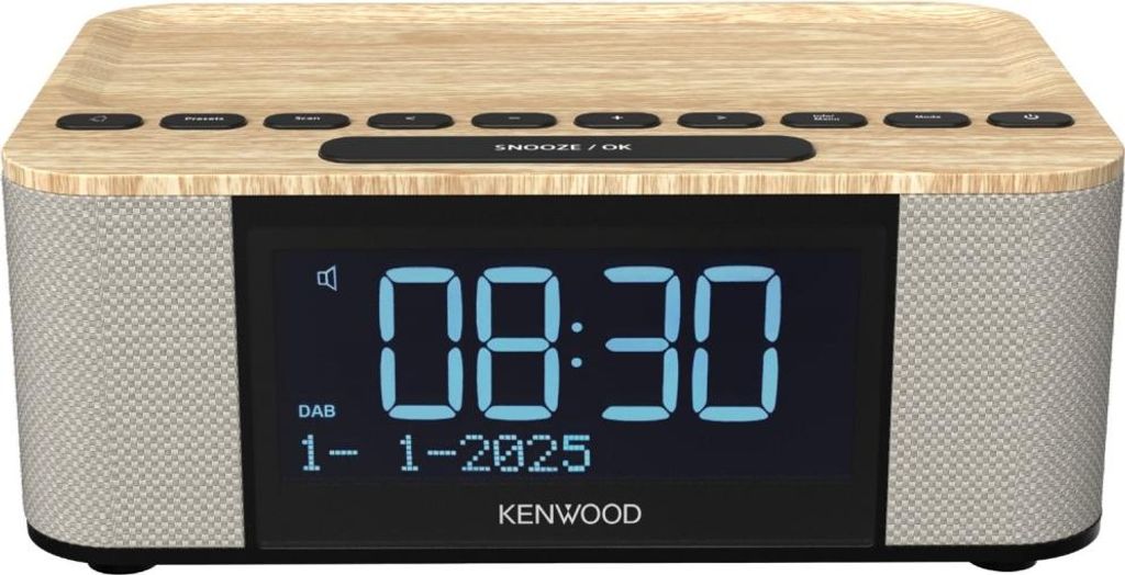 A digital alarm clock radio with a wood-effect top and fabric speaker grilles.