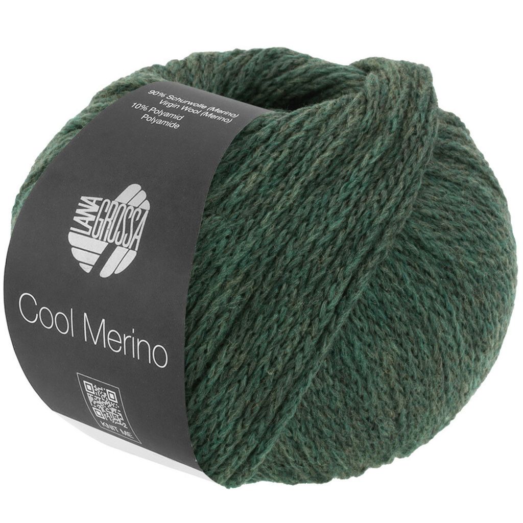A ball of green yarn with a dark label wrapped around it.