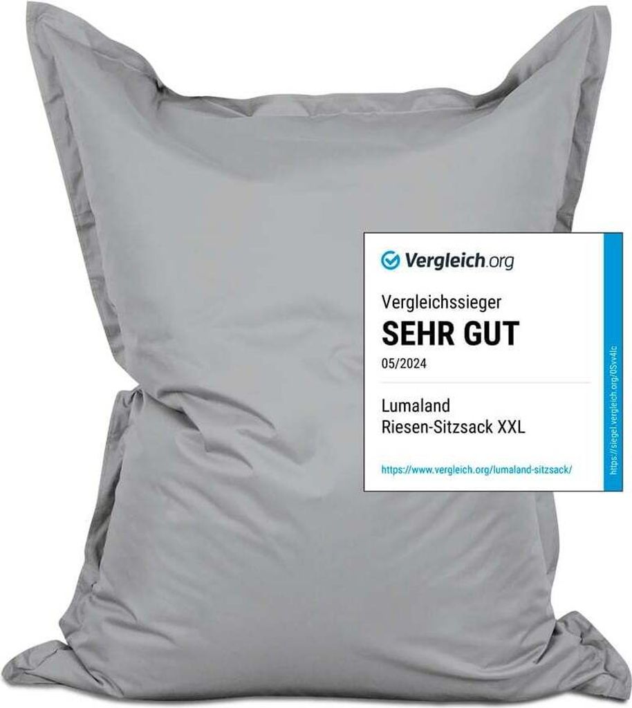 A large, light gray beanbag chair, possibly for outdoor use, with a review badge superimposed.