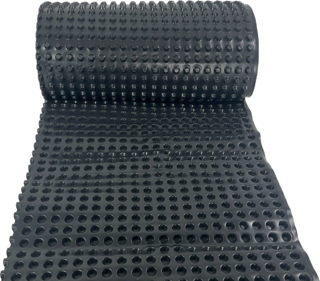 A roll of black drainage membrane with raised studs, unrolled on a white background.