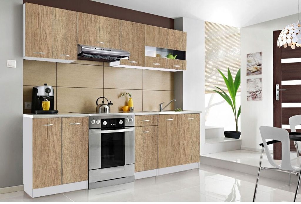 A modern kitchen setup with wooden cabinets, stainless steel appliances, and a window with blinds.