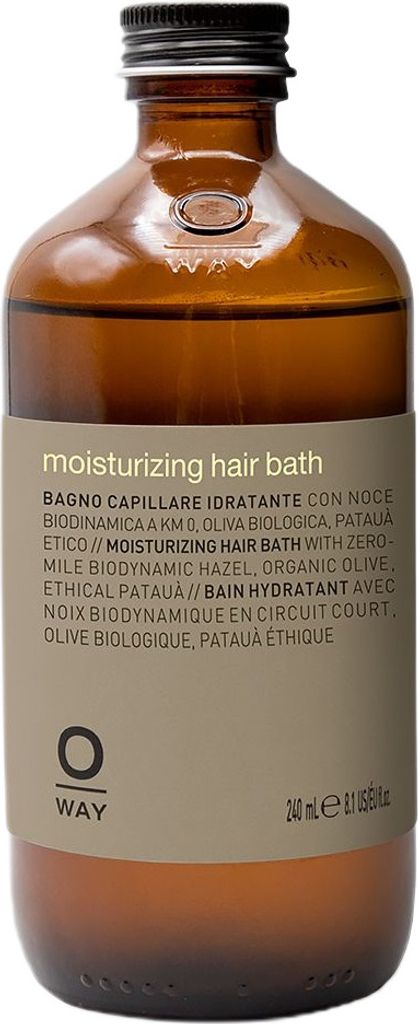 A brown glass bottle of OWAY Moisturizing Hair Bath with a label.