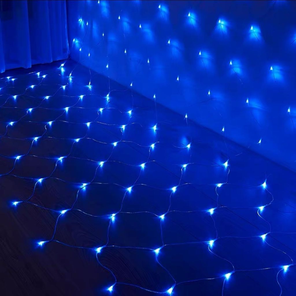 A net of blue LED lights is draped over a floor and up a wall, creating a decorative lighting effect.
