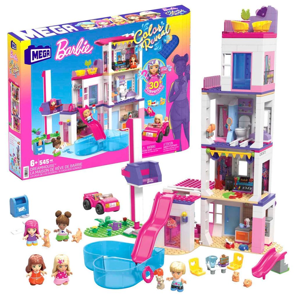 A Barbie Dreamhouse playset with accessories and figures, along with its packaging.