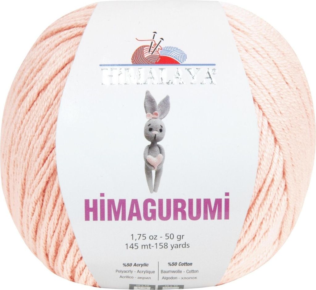 A ball of pink yarn with a label showing a knitted bunny and product information.
