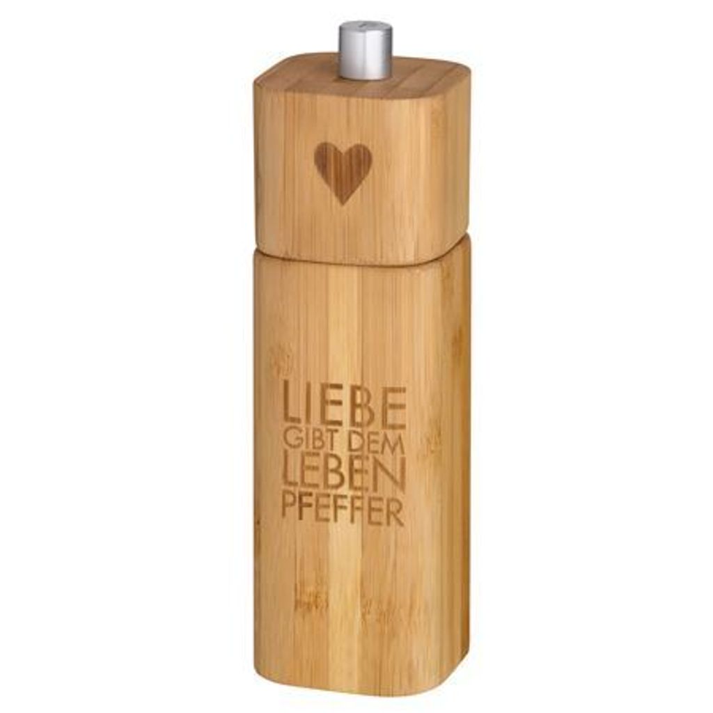 A wooden pepper mill with text and a heart design.