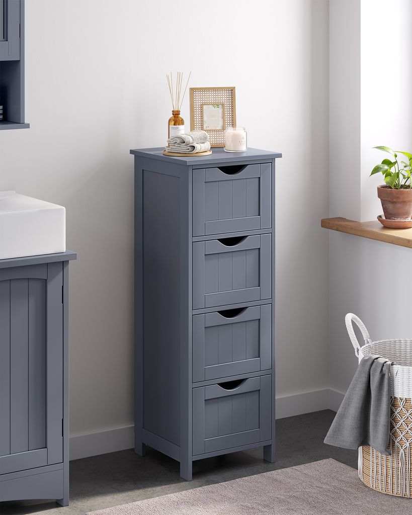 A gray bathroom cabinet with four drawers stands against a white wall, next to a sink.