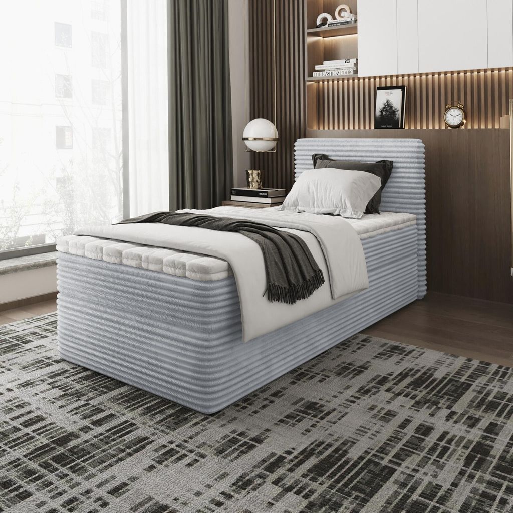 A bedroom scene with a bed, window, and decorative elements.