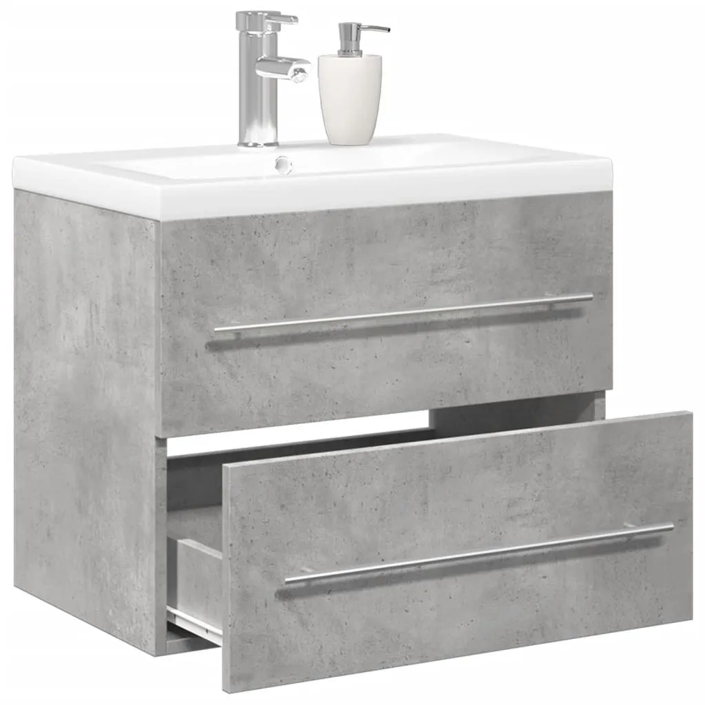 Aménagement salle de bains gris béton avec meuble sous-vasque et miroir