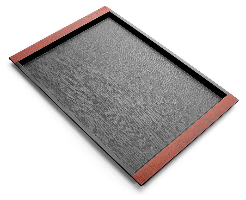 A rectangular tray with a dark gray textured surface and a reddish-brown border.