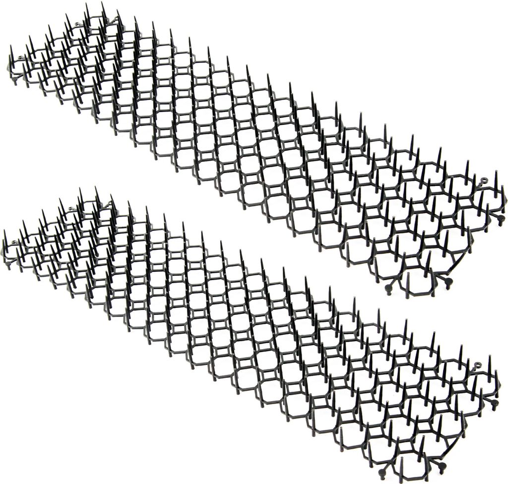 Two black plastic spike strips arranged diagonally on a white background.